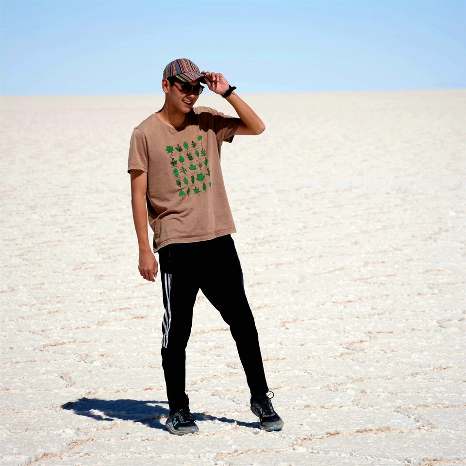 Yutaro Sakairi standing outdoors on a bright salt flat